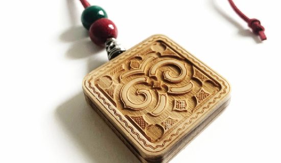 A pendant with Ainu pattern